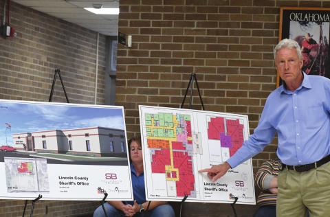 Lincoln County Sheriff Charlie Dougherty points to a floor plan while explaining a point during the public Q&amp;A meeting about the county elections. Photo/Brian Blansett