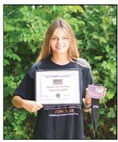 Jimmie Brownfield, w ith some of her power-lifting awards. File photo/Brian Blansett