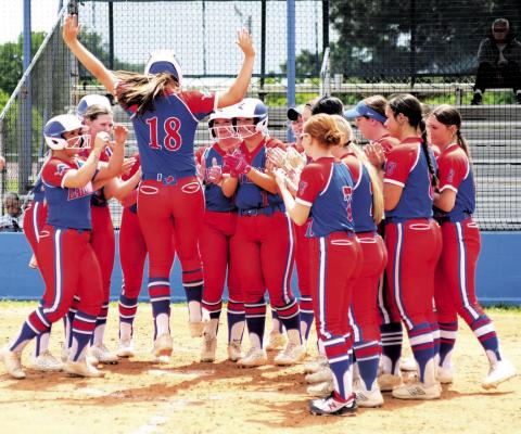 Chandler’s Payslee Massengale gives a double-footed stomp on home plate after hitting a home run against Berryhill in the district tournament on Thursday. Photo/Brian Blansett