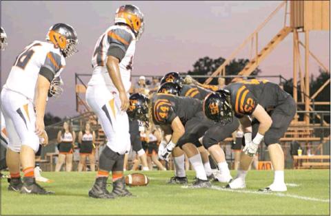 Davenport’s offense lines up in preparation for a snap against Strother. Now 3-1 after dispatching the Jackets, the Bulldogs host Dewar next Friday at 7:30. Photo/Kim Hobill