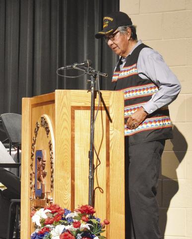Chandler Marine Corps and Vietnam veteran Charlie Hill speaks at ceremonies at Chandler High SchoolP. hoto/Emily Kalka.