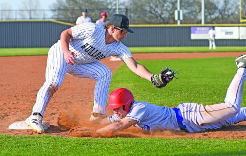 Chandler runner Levi Becktol dives back to third under the tag of Meeker third baseman Maverick Herring. Photo/Brian Blansett