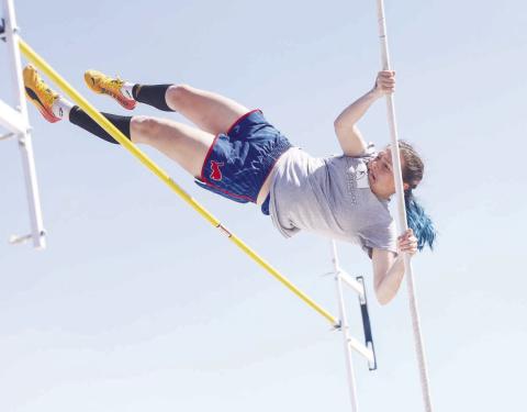 Adelaide Furtado competing at the Hennessey track meet on Friday. She cleared 10 feet and one inch, typing the Chandler school record. Photo/ Mario Holland