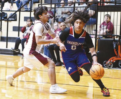 Chandler senior Javarious Wade penetrates on the dribble against Sequoyah-Tahlequah. Photo/Brian Blansett
