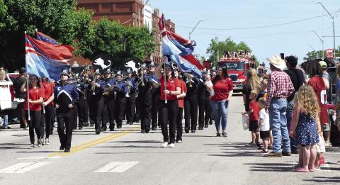 The Chandler high School band followed the color guard to lead the parade down Manvel Avenue Saturday and entertained the crowdalong the way. Photo/Brian Blansett
