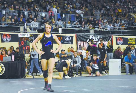 Freshman Lizzy Pryor from Chandler takes a walk during her first consolation semi-finals match on Saturday at the state wrestling tournament. This was her first trip to the Big House and also her last, since the Jim Norick Arena is being replaced with a new building. Pryor ultimately placed fourth in her weight class and will start next season ranked No. 4. Photo/Emily Kalka