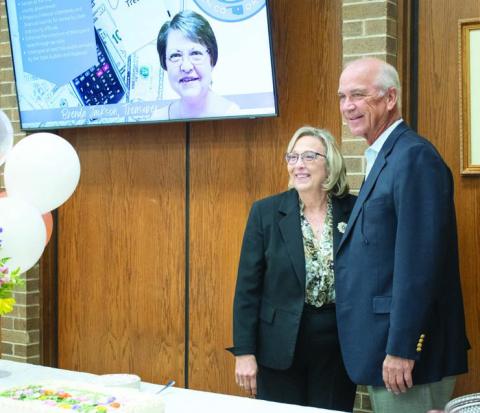 Above, Court Clerk Cindy Kirby poses with Justice Douglas L. Combs from the Oklahoma Supreme Court during her retirement reception at the Lincoln County Courthouse on Oct. 24. Kirby has spent 21 years as the court clerk and will begin a new position with Oklahoma State University, training new court clerks and deputy court clerks. At the reception, Kirby thanked county workers, her staff and her family and friends for supporting her during her elections and years working at the courthouse. Photo/Emily Kalka