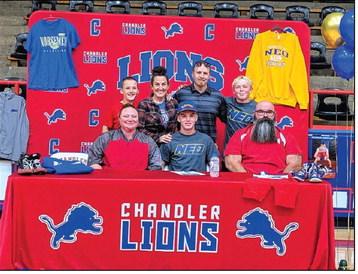Chandler senior Landon Earp (front, center) has commited to wrestling for Northeastern OklahomaA&amp;M College. He signed a letter of intent on Monday, May 4 at the Freeman Fieldhouse. Here he sits surrounded by wrestling coaches Kallie Jo Petrie (left) and Franklin Ward (right), with his brothers and parents behind him. Photo/Jennifer Pryor