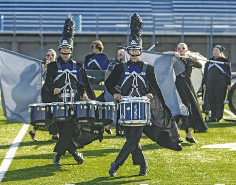 James Kerr (left) and Samuel Gardner (right), members of the Pride of Chandler marching band, perform at OSSAA NE Marching Band Regionals on Oct. 15. Photo/Jennifer Pryor