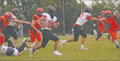 Colt Metcalf (22) picks up yardage for Davenport against Yale while Aidan Elmore (72) blocks for him. Photo/Allie Prater