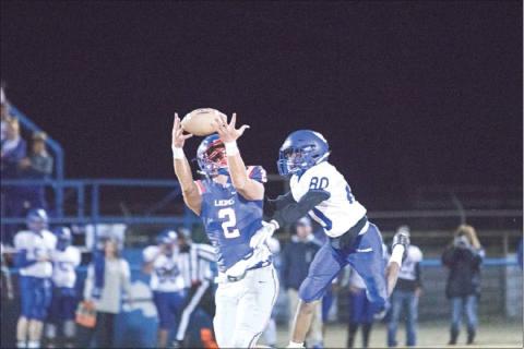 Friday night was the last time for brothers Dylan Mahan, Braxen Burnes and Darian Mahan to suit up together in a regular season game. Above, Dylan, a senior, goes for a pass in the Lions’ win over Holdenville. Photo/ Braden Wade