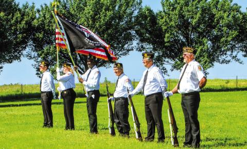 The American Legion Post #64 color guard stands at ease at Davenport Cemetery on Monday morning. Photo/Jennifer Pryor