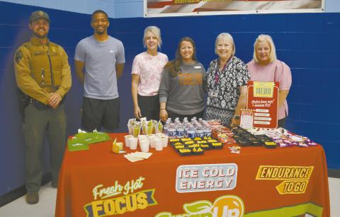 From left to right are Lincoln County Game Warden Jacob Harriet, Coach Damon Parker, Family Support Coordinator Gina McVey, School Nurse Jessica Todd, Sherri Ripley with TSET and Diann Merrmann with the Lincoln County Partnership for Child Well-Being. Photo/Emily Kalka
