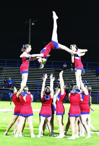 Chandler’s cheer squad treated the crowd to a well-executed suspended kick through a hitch pyramid during halftime at the Lions’ game with Tulsa Webster Friday. The Flyers are Layla Gilpatrick, Jordan Glasgow and Shylee Almond. Photo/Brian Blansett