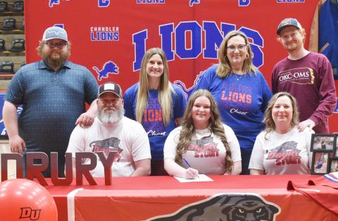 Makyela Dawkins from Chandler, front row, center, signed with Drury College from Springfield, Mo., for the STUNT team. She is pictured with (back row) Jason Brown, Hannah Smith, Cynthia Snider, Keegan Dawkins (front row) Jerry Dawkins and Taressa Dawkins.