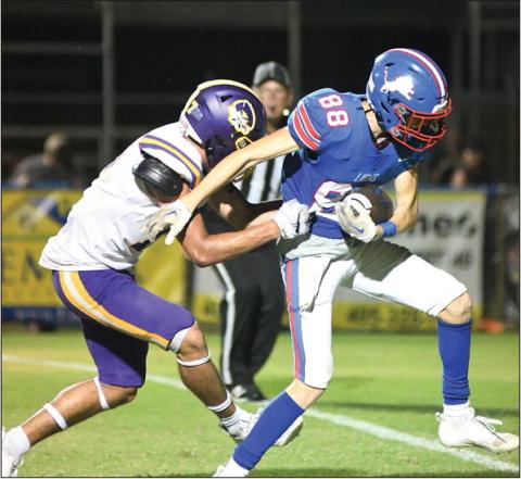 Corbin Hollon (88) drags a Bristow tackler into the end zone for the game-winning touchdown. Photo/Brian Blansett