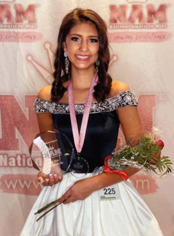 Pictured above, Laryssa Nunn stands with her Oklahoma Jr. Teen Academic Achievement award and runner-up in the overall Oklahoma Jr. Teen award. Photo/submitted.