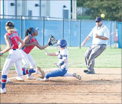 Stroud senior Terra Mitchell slides safely into third base in their 3-2 win over Chandler last week. Waiting for the throw is the Lady Lions’ Jaelynn Robertson. Photo/Tommie Marshall