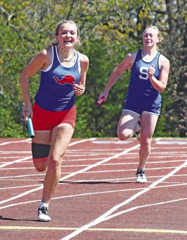 Chandler freshman Lila McGough makes the final turn in the 4x200 relay last week at the 66 Conference meet. Photo/Brian Blansett