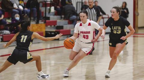 Top, Prague’s Jadyn Hightower dribble through the Latta press during the Lady Devils’ game last week. Photo/Rick Hester