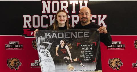 North Rock Creek’s Kadence Munn became the first girl to score 1,000 points for the Lady Cougars. She hit the mark last week against Tecumseh at the Washington tournament. She is shown with coach Lance Blocker. Photo/Sheryl Gowin