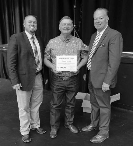 Davenport Agricultural Education Instructor and FFA Advisor Robert Carroll received a certificate for 40 years of service to teaching agricultural education in Oklahoma at the State Career Tech Summit in Tulsa on August 2. Pictured with Mr. Carroll is Josh Davis, 2023-24 OAETA President, and Scott Nemecek, State FFAAdvisor. Photo/Marty Coulson