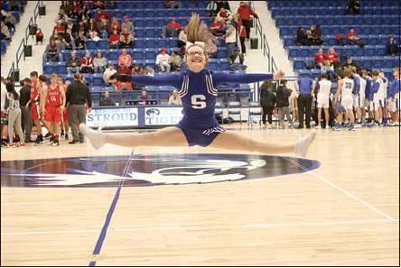 . Below left, Stroud’s Kristabella Gaylord entertains the crowd during a break in action during the Tigers’ opener with Prague. Photo/Tommie Marshall.