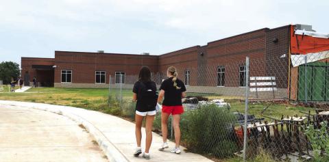 Students walk into the new high school building at Prague. Photo/Emily Kalka