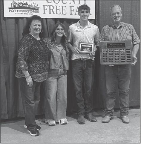 Braxton Roberts from Bethel FFA was the recipient of the 2025 Ann “Sis” Gilbert Outstanding Junior at the Fair Award. Pictured from left, are Suzanne Gilbert, past recipient Poppy Robinson, Braxton Roberts and Randy Gilbert.