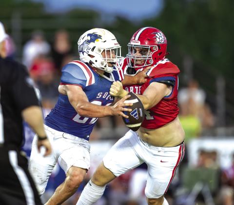 Defensive End Graham Hill from North Rock Creek High School puts heavy pressure on the quarterback at the Citizen Potawatomi Nation All Star Bowl. Photo/Rick Hester