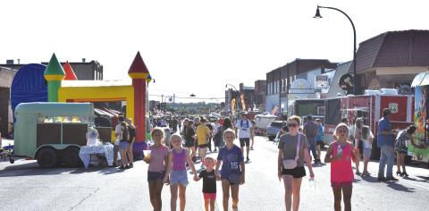 People crowd Main Street/Route 66 in Stroud for the town’s annual SummerFest on June 13. This year’s festival was bigger and better, ending with a firework display. Photo/ Emily Kalka