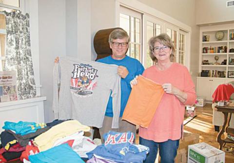 Pictured above, Chandler residents Steve and Jean Lucas hold up t-shirts that will soon be sent to Illinois where they will be cut up and sew into diapers for expecting mothers in Nicaragua through the program Casa Materna, a program through the organization Misión Para Cristo. Photo/Brian Blansett.