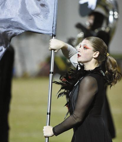 Sophomore Allison Radcliffe, a member of the Pride of Chandler Color Guard, performs The Raven during halftime on Friday night. It was the first-round playoff game for Chandler. Photo/Brian Blansett