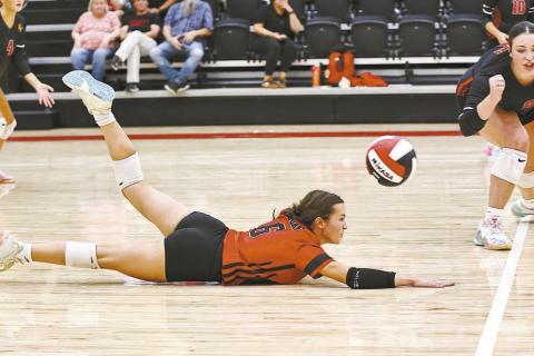 Jaynie Ford dives for the ball for the Lady Cougars, who are 8-4 for the season. Photo/Sheryl Gowin