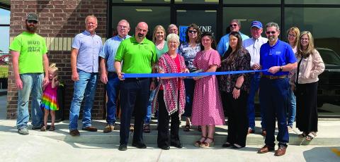 The Chandler Area Chamber of Commerce held a ribbon-cutting last week for Payne County Bank, which moved to its new location at 111 N Sandy Ln., Suite G in Chandler. Holding the scissors is Teresa Harkins, Vice President of Payne County Bank. Photo/Elizabeth Golliver
