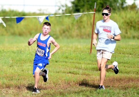 The cross-country season started with the traditional opening meet at Stroud on Saturday. Above, Chandler seventh-grader Fischer Harris competed in his first-ever sports event and finished the course with running buddy Jay Duncan. Right, North Rock Creek’s Kadence Munn was the top finisher among local runners, finishing third in the girls’ event. See Page 1C for more. Photos/Brian Blansett