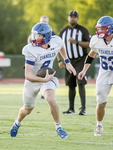 Above, Chandler quarterback Alec Jackson takes off on a run against Heritage Hall. Photo/Mario Holland. Below, NRC’s Caleb Hawkins, left, and Memphis Burdine celebrate a touchdown against Stroud. Photo/Brian Blansett