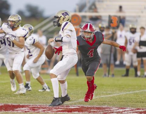 North Rock Creek’s Jordan McClain (4) forces a fumble by knocking the ball out of the Mannford quarterback’s hand Friday night during the Cougars’ Homecoming game.. The fumble was recovered by NRC’s Kaiden Samuels. NRC bested the Pirates, 24-2, to move to 2-3 for the season and 1-1 in District 3A-1. The Cougars travel to Mount St. Mary’s Friday night and could move into a tie for second place in the district if they win. Photo/Rick Hester.