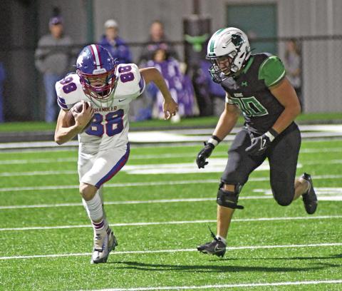 Corbin Hollon (88) heads up the field after a reception Friday night against Jones. Photo/Brian Blansett