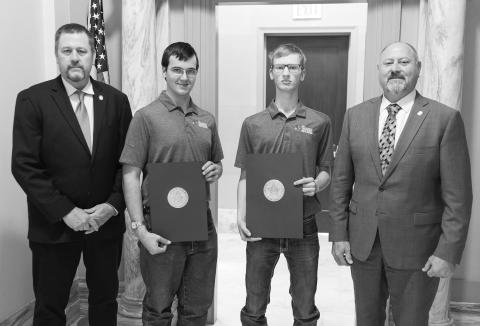 State Rep. Kevin Wallace, right, and state Sen. Grant Green pose with 2022-23 Agriculture Youth Council members Ethan Stone and Kolton Hunt at thes tate Capitol. Stone is a senior at Chandler High School and Hunt is a senior at Wellston High School.