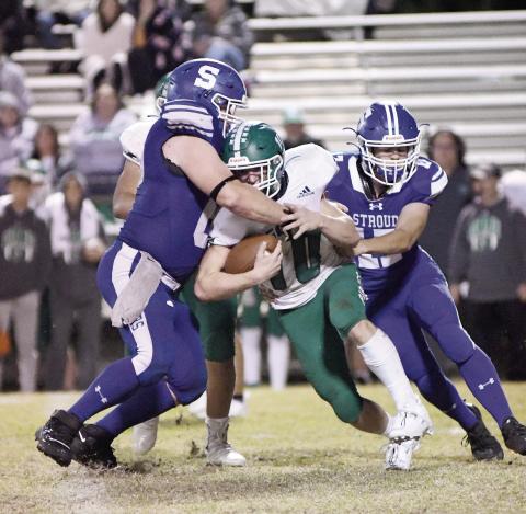 Stroud’s Peyton Gaylord ( 68) and TaylorRozell wrap up Gore’s Devon Mannon during the first half Friday. Photo/Brian Blansett