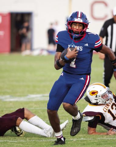 Javarious Wade leaves a couple of would-be tacklers in his wake Friday night in Chandler’s win over Clinton. Photo/Brian Blansett
