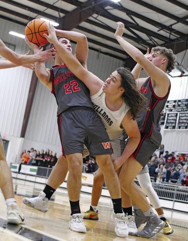All the schools in Lincoln and Pott counties are into basketball season now. Above, Meeker’s Connor Wolf (white jersey) defends against Wellston’s Tyler Evans (22) Friday night during Wellston’s 68-57 win over the Bulldogs. At right is Wellston’s Kage Danker. In the girls’ game, Meeker broke a 25-game winless streak. See page 1C for more. Photo/Brian Blansett