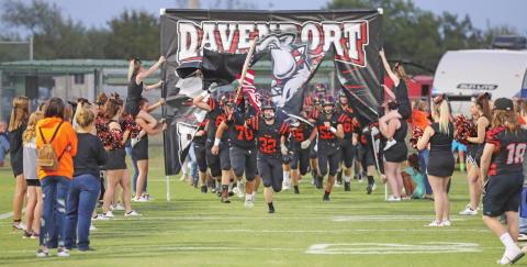 Davenport’s Bulldogs charge on to the field Friday night before tasking on Strother. They didn’t slow down much, hanging a 48-0 decision on the Yellowjackets. Photo/Rick Hester