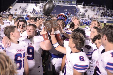 Chandler’s Lions hoist the BancFirst trophy for the fourth straight year after beating Stroud, 26-6, Friday night at Jack Poskey Field in Stroud. It was one of two big Lincoln County rivalry week games, the other being Prague’s 28-14 win over Meeker. For more on those games and other sports, see Pages 1-4C. Photo/Brian Blansett