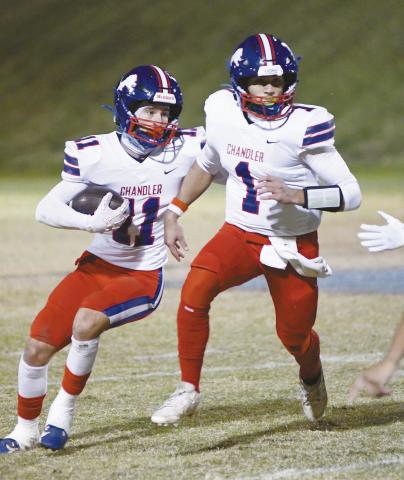 Chandler’s Ty Garver (11) follows the block of fellow senior Cruz Jackson(1) Friday night at Millwood. Photo/ Brian Blansett