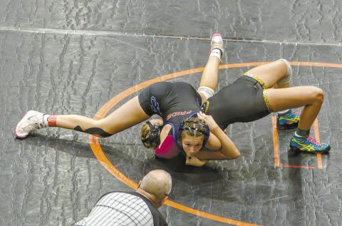 Chandler wrestler Shailey Penn looks for the referee to signal a pin during the First Annual Kyle Sam’s Memorial Open Tournament in Cushing on Nov. 9. She placed first in her weight category (120-125 pounds) and is one of six girls on Chandler’s Wrestling Team. Photo/Jennifer Pryor