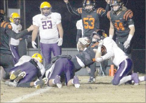 Kyle Hobill (10) scores one of his three touchdowns against Weleetka.