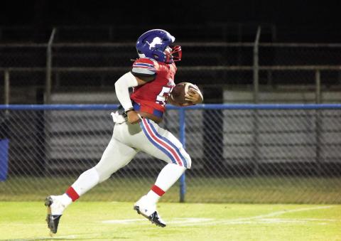 Chandler’s Travian Tillis heads to the end zone after stripping the ball from a Tulsa Webster player Thursday night. The strip-and-score and resulting kick made the score 62-0. It was Tillis’s first game back after an injury. Photo/Brian Blansett