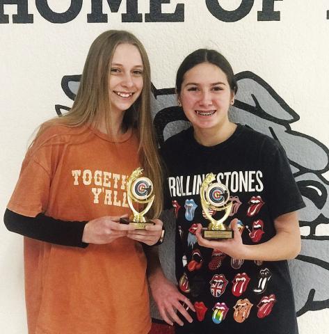 Meeker archers Addilyn Tipton and Taos Pino brought home the top two middle school awards from the El Reno archery tournament. Tipton, left, an eighthgrader, took second and Pino, right, a seventh-grader, took first.